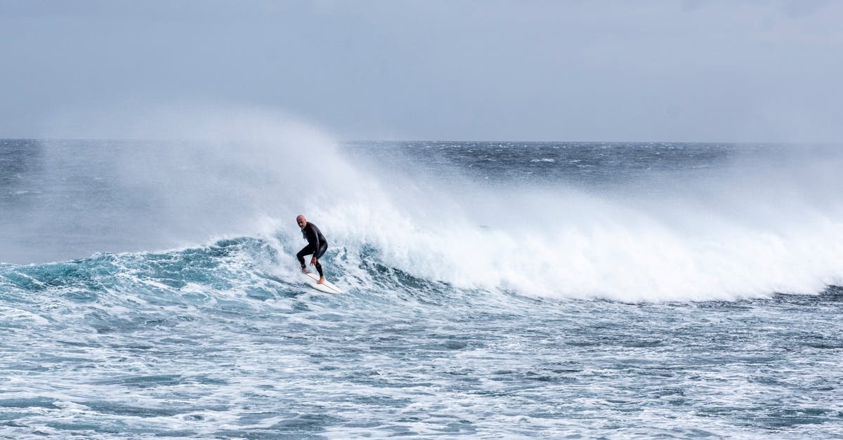 Thrilling image of a surfer riding powerful ocean waves, showcasing adventure and skill.