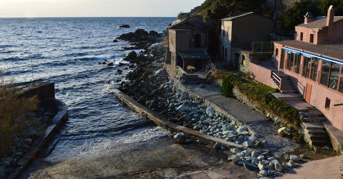 Charming coastal village with rugged shoreline and rustic buildings in Canari, Corsica.