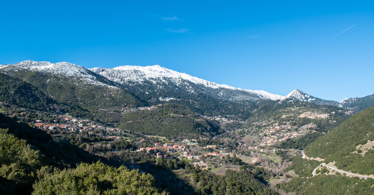 Scenic view of snow-covered mountains and village in Divri, Greece.