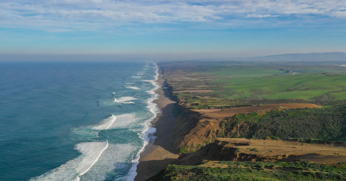 Breathtaking aerial view of Point Reyes National Seashore with sweeping coastline and lush landscapes.