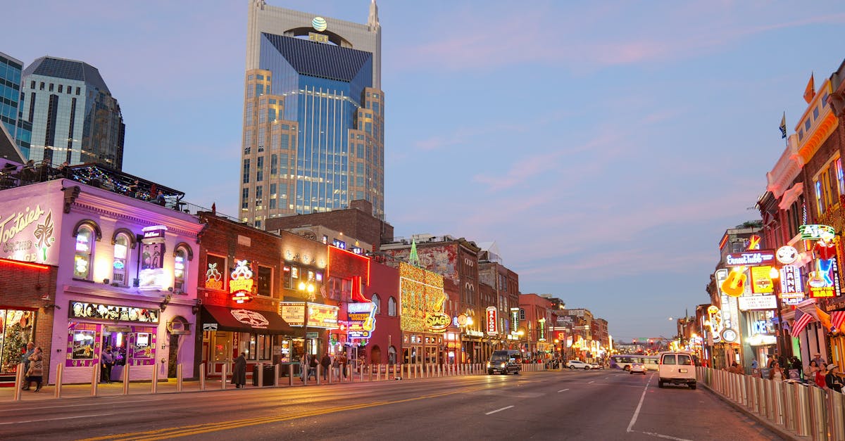 Explore the lively streets of Nashville, Tennessee with bright neon signs and iconic architecture.
