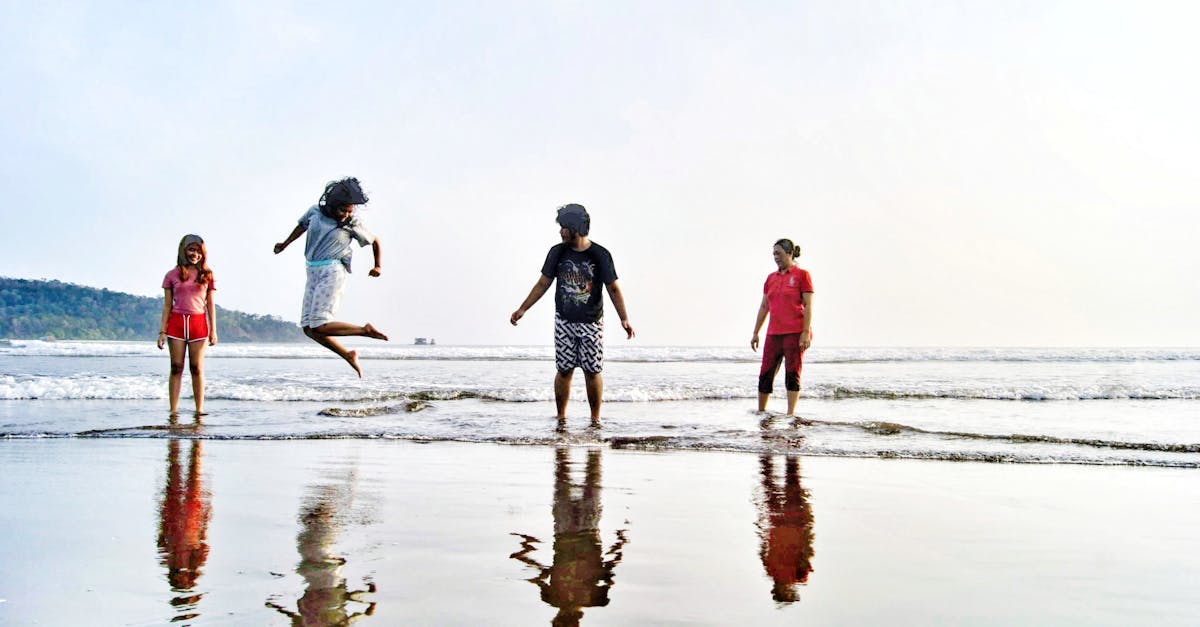 Four friends enjoying a fun day at Pangandaran Beach, West Java, Indonesia.