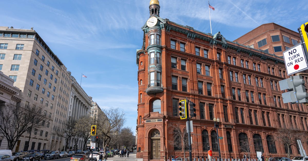 A vibrant daytime view of iconic architecture in Washington, DC, with clear blue skies.