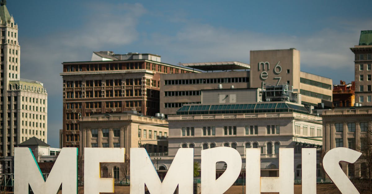 View of the Memphis sign set against the historic city skyline, showcasing iconic architecture.