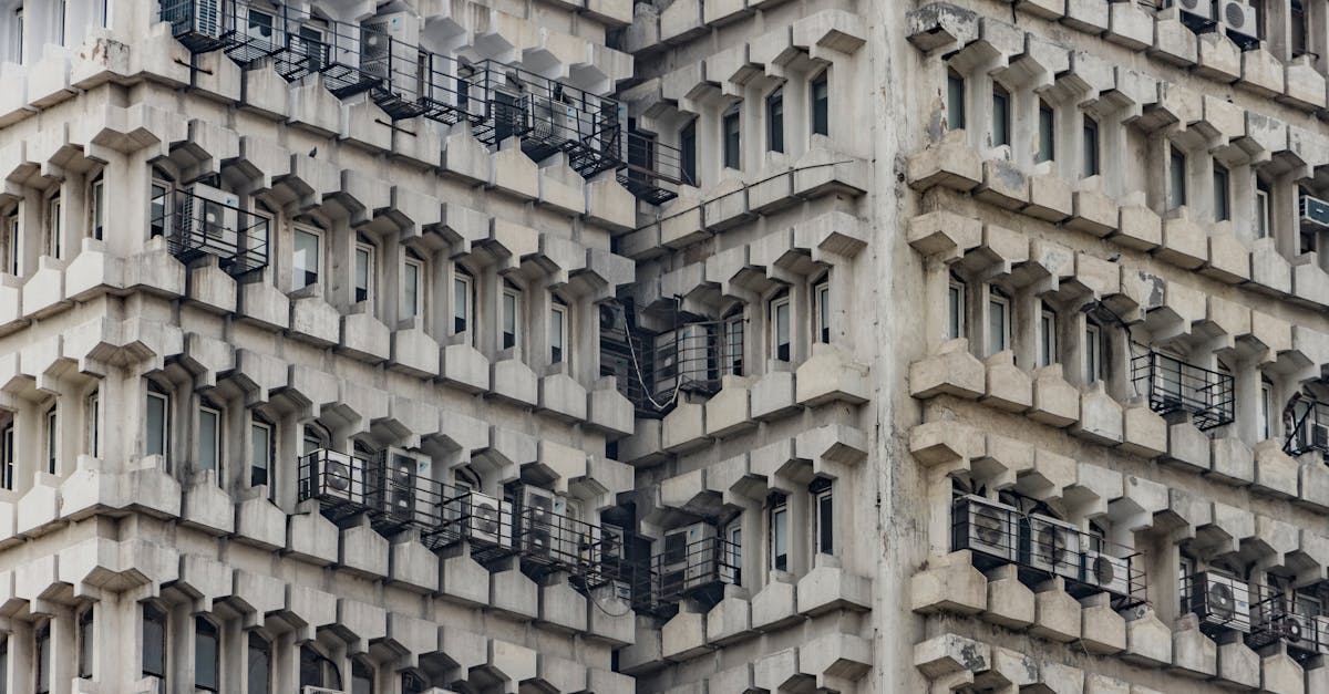 A detailed view of a brutalist building facade in New Delhi, India, showcasing architectural symmetry.