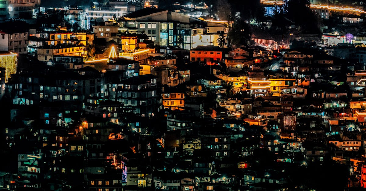 A cityscape at night showcasing illuminated buildings and vibrant lights, capturing urban nightlife.