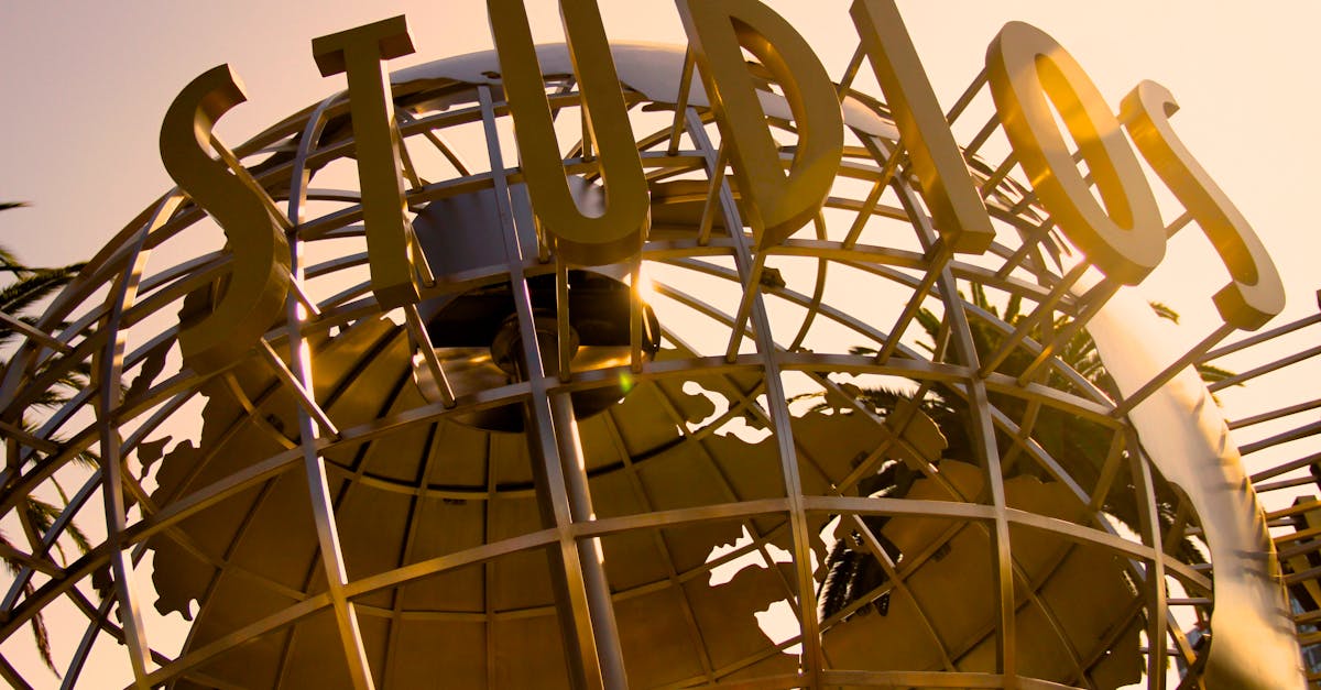 Iconic Universal Studios globe sculpture at sunset, symbolizing Hollywood magic.