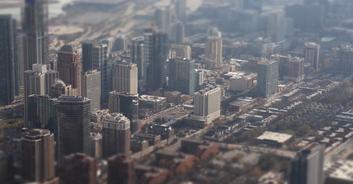 Aerial view of downtown Chicago with buildings appearing miniature due to tilt-shift effect.