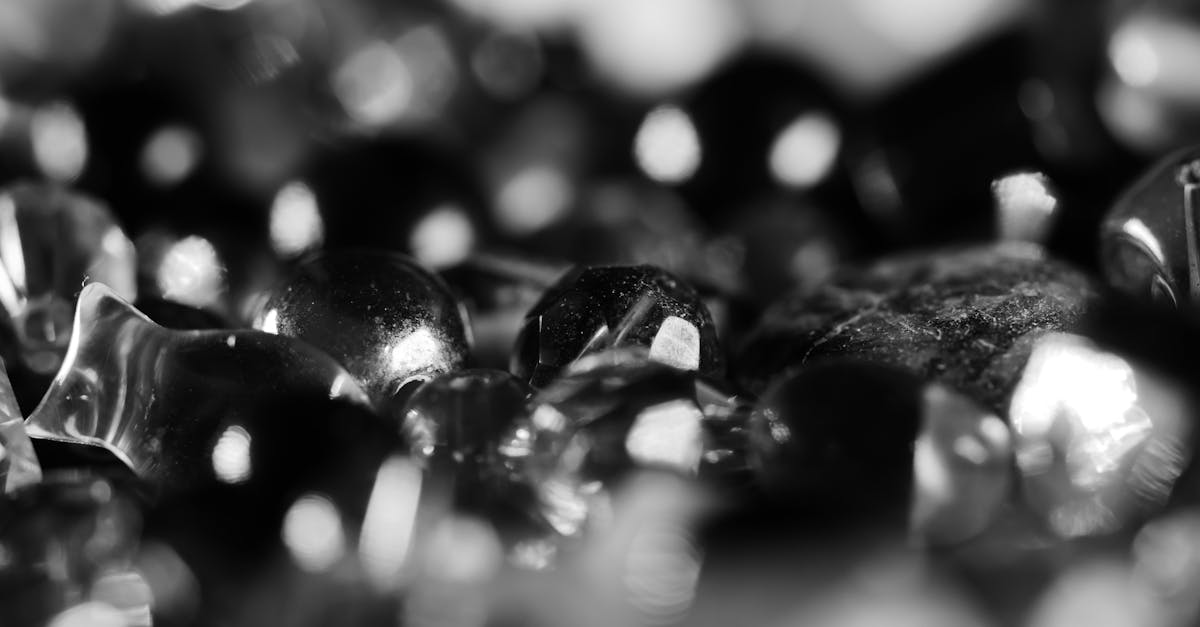Detailed close-up of shiny black and white beads in grayscale photography.