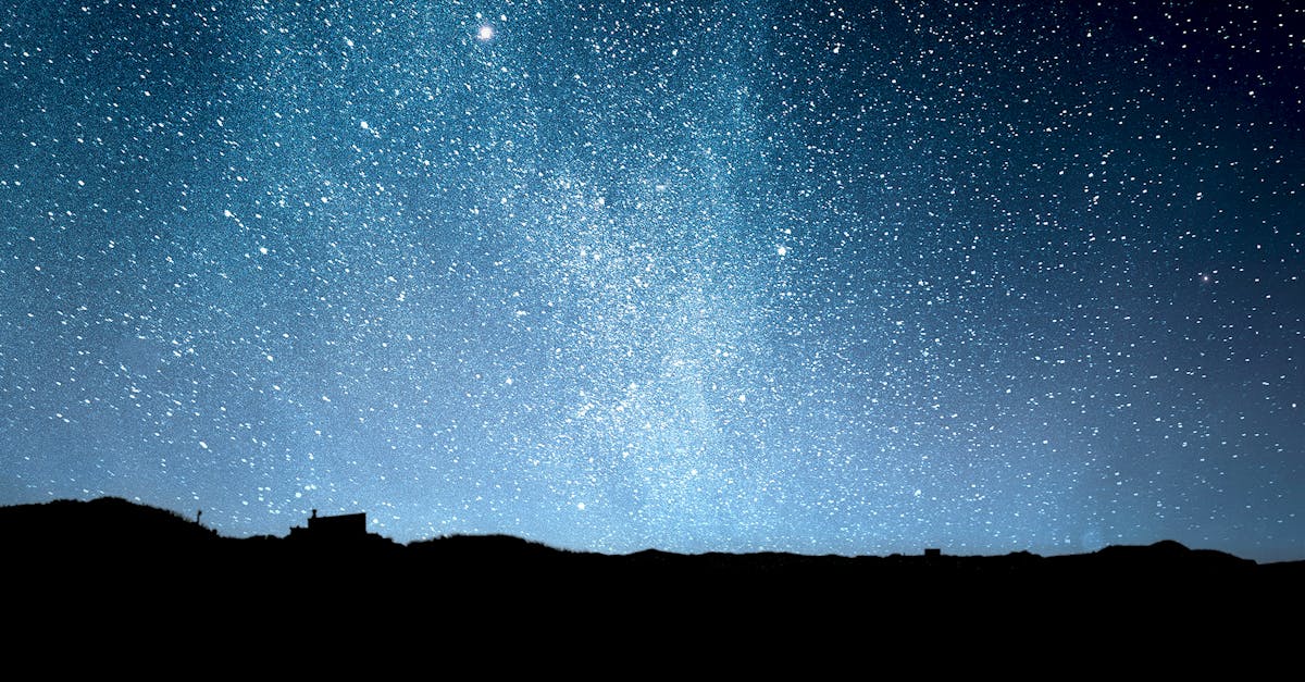 A breathtaking view of the starry night sky over the horizon, capturing the Milky Way's brilliance.