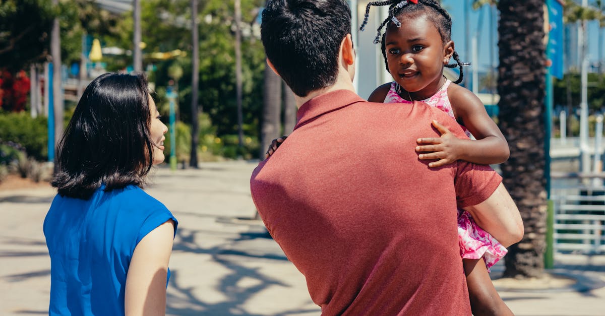A joyful multicultural family enjoying a sunny day outdoors.
