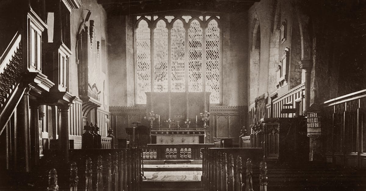 Elegant black and white photograph of a church interior, capturing historic architectural details.