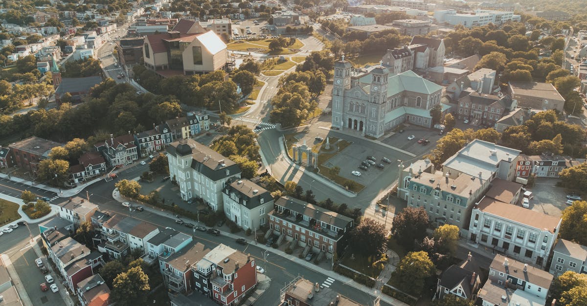 Stunning aerial view of a picturesque cityscape featuring prominent church and residential buildings.