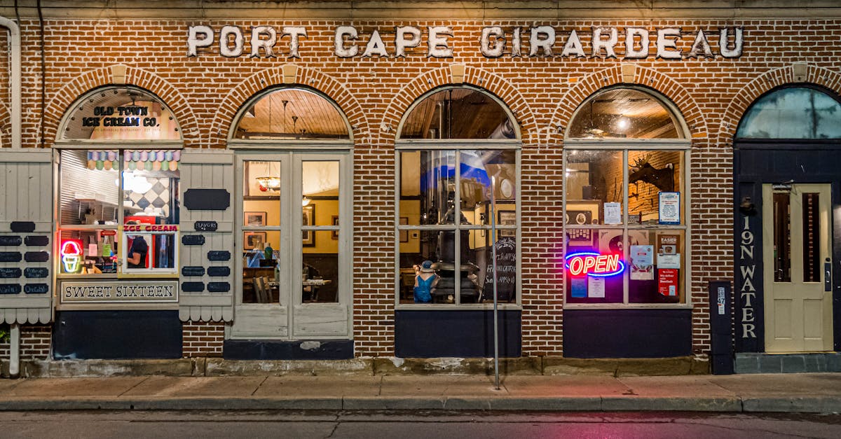 Charming ice cream shop in historic Port Cape Girardeau, MO, with neon signs glowing at night.